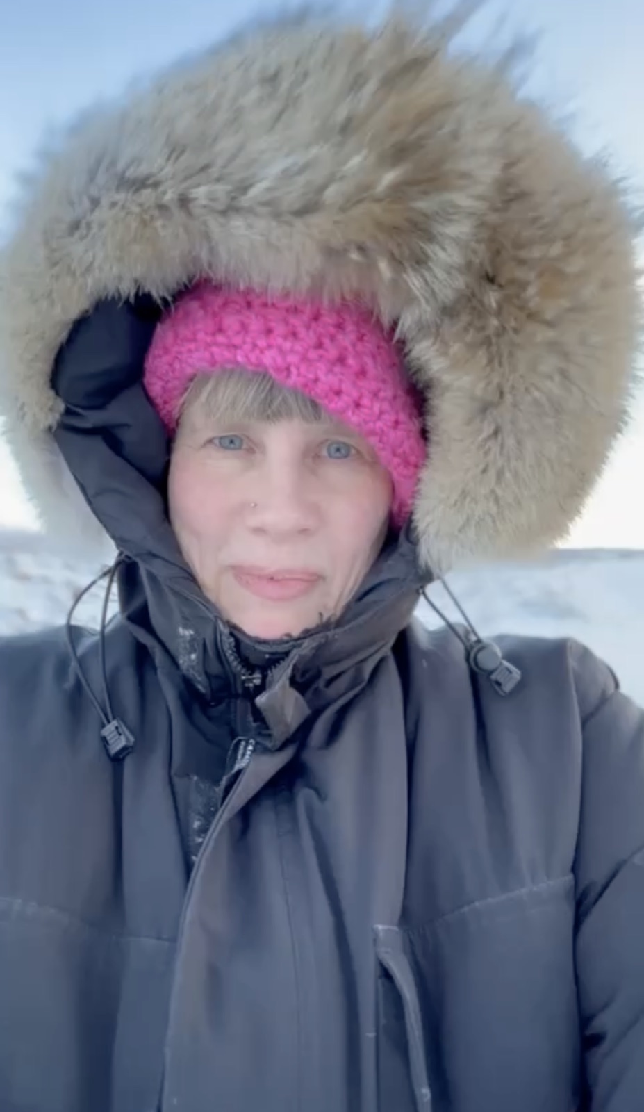Lara in Iceland, hood up against the cold